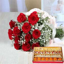 Stunning Red Roses along with yummy assorted Sweets