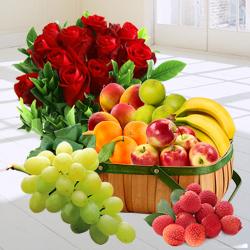 Bright Decadence Souvenir of Fresh Fruits in a Basket nd a Bouquet of Red Roses