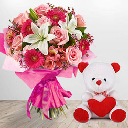 Magnificent Flower bouquet along with a cute Teddy Bear gift