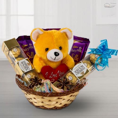 Delightful Chocolates with Love Teddy in a Basket to Tirur