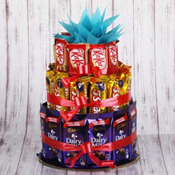 Enticing 3 tier Arrangement of Assorted Chocolates to Punalur
