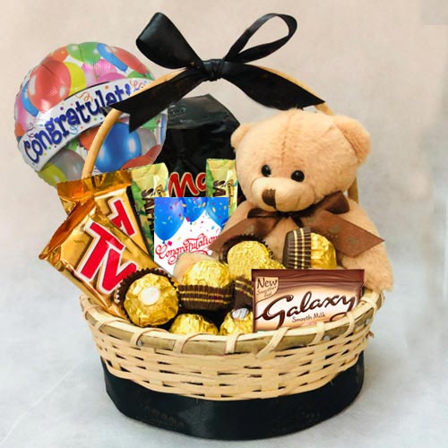 Delectable Gift Basket of Chocolates N Teddy to Rajamundri