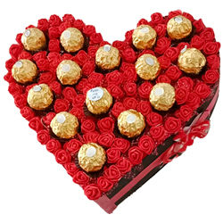Ecstatic Heart Arrangement of Sapphire Hazelfills Chocolates on Roses to India