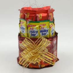 Ambrosial 3 Layer Tower Arrangement of Nestle Chocolates to Kanjikode