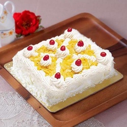 Delicious Eggless Pineapple Cake to Tirur