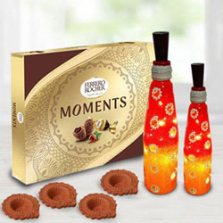 Exclusive Diwali Gift of Ferrero Rocher Chocolates n Twin Bottle Art Lamp n Diya to Hariyana