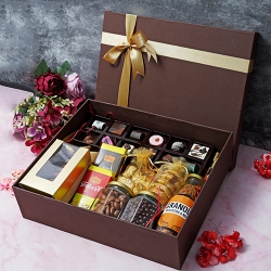 Classically Arranged Mothers Day Crunchy N Sweet Treat Box to Marmagao