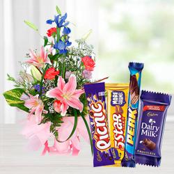 Stunning Assorted Flowers Arrangement with Mixed Cadbury Chocolate  to Muvattupuzha