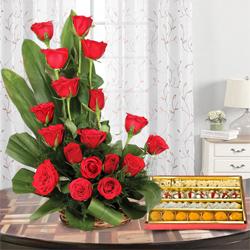 Bright charming 18 Red Roses and delicious mixed Sweets to Kanjikode