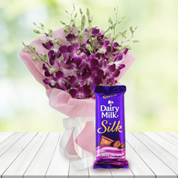 Wonderful Bouquet of Orchids and Cadbury Dairy Milk Silk to Muvattupuzha
