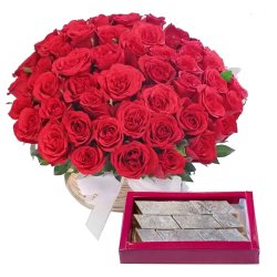 Astonishing 50 Red Roses along with delicious Kaju Barfi to Alwaye