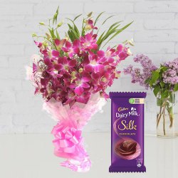 Combo of Cadbury Dairy Milk Silk and Orchids Bouquet to Irinjalakuda