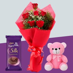 Delightful Red Roses Bouquet with Teddy N Cadbury Dairy Milk Silk to Punalur