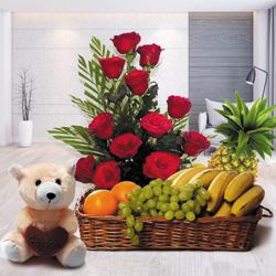 Marvelous Teddy with Roses Arrangement and Fruits Basket to Marmagao