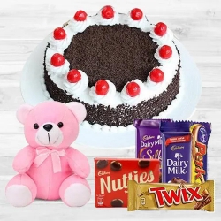 One-of-a-Kind Black Forest Cake with Assorted Cadburys Chocolate and a Small Teddy to Rajamundri