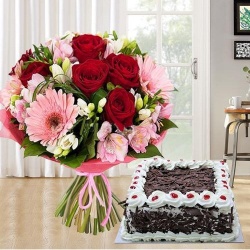 Majestic multi colored Seasonal Flowers along with tasty Black Forest Cake to Nipani