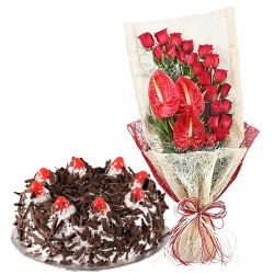 Captivating Red Roses n Anthodium Bouquet with Black Forest Cake to Punalur