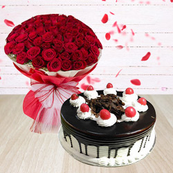 Extravagant Red Roses Arrangement with Black Forest Cake to Uthagamandalam
