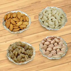 Pleasurable fiesta with mouth-watering Dry Fruits and Silver plated bowls to Punalur