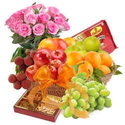 Scrumptious Fresh Fruit Basket with Haldiram Soan Papdi and Rose Bouquet to Tirur