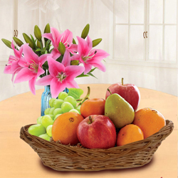 Tasty Fresh Fruits Basket with Pink Lilies to Rajamundri