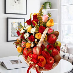 Remarkable Fruits n Mixed Flowers Gift Basket to Marmagao