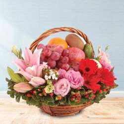 Breathtaking Fresh Fruit Basket with Flowers for Moms Day to Marmagao