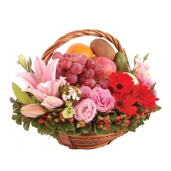 Artistic Basket of Fresh Fruits decorated with Lily, Roses n Gerberas to Irinjalakuda