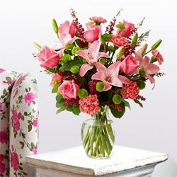 Exquisite special arrangement of fresh Lilies, Roses and Carnations  to Alwaye