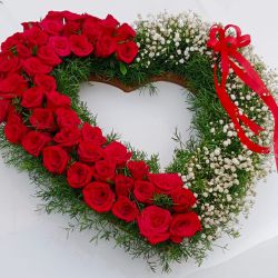 Remarkable Red Rose with white Baby Breath fillers Heart Shape Bouquet to Karunagapally