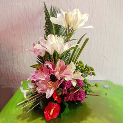 Stunning Lilies N Anthodium Basket Arrangement to Muvattupuzha