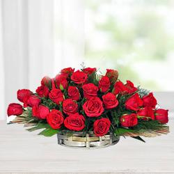 Cheerful Assortment of Red Roses with Fillers in a Basket to Uthagamandalam