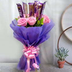 Delightful Bouquet of Pink Roses with Cadbury Dairy Milk to Kanyakumari