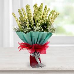 Exquisite Hand Bouquet of Tuberoses with Tissue Wrapping to Muvattupuzha