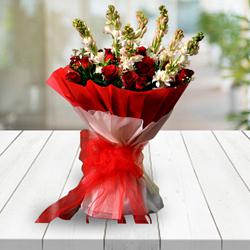 Classic Congratulations Bouquet of Red Roses n White Tuberose with Tissue Wrapping to Tirur