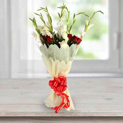 Beautiful Bouquet of Gladiolus N Roses in Tissue Wrap to Kanyakumari