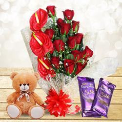 Mesmerizing Gift of Red Flowers Bouquet with Cute Teddy n Chocolates to Uthagamandalam
