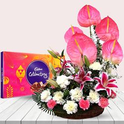 Exclusive White N Pink Flowers Arrangement with Chocolates to Uthagamandalam