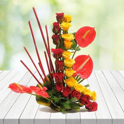 Exquisite Arrangement of Red N Yellow Roses with Anthurium to Kanjikode