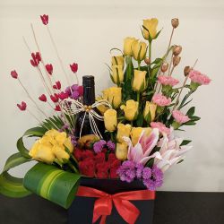 Spectacular Mixed Flowers Box Arrangement with Sparkling Fruit Juice to Kanjikode
