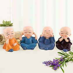 Attractive Set of 4 Buddha Monks Figurines to Taliparamba