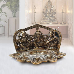 Attractive Metallic Diya with Ganesh, Lakshmi N Saraswati Idol to Coochbehar