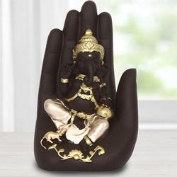 Exquisite Handcrafted Palm Ganesha Showpiece to Hariyana