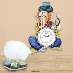 Marvelous Ganesha Wooden Wall Clock N Iris Aroma Candle to Attingal