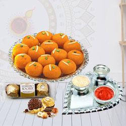 Attractive Combo of Ladoo with Ferrero Rocher N Pooja Thali to Cooch Behar